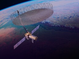 A rendering of the NISAR satellite in space.